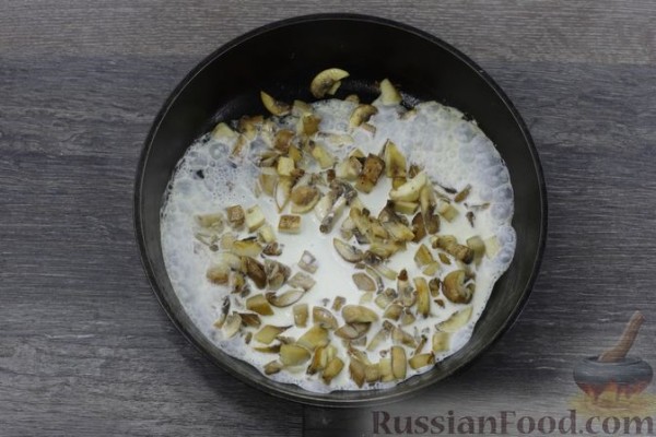 Отбивные из свинины, запечённые с грибами и помидорами